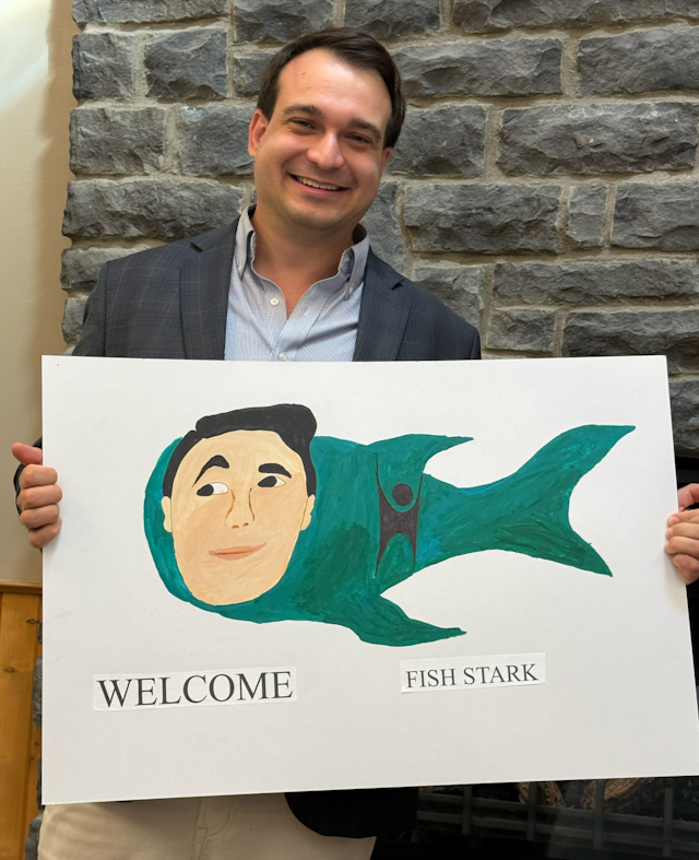 Fish Stark with our welcome sign